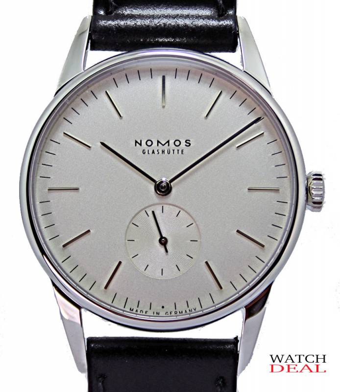 Nomos Glashütte Orion White Manual Winding Exhibition Case Back 35mm 306 ✓ Luxury watches from Nomos Glashütte at fair prices ✓ No platform ✓ Personal delivery ✓ Telephone advice ✓ Watchdeal has luxury watches at low prices for over 30 years ✓